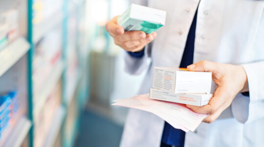 pharmacist-holding-medication